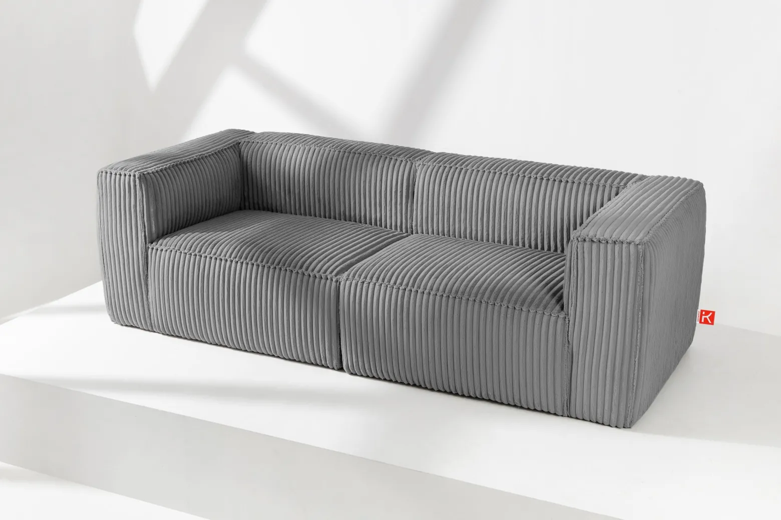 KONSIMO FEROX Nowoczesna sofa trzyosobowa w tkaninie sztruksowej